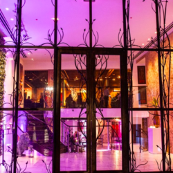 Wedding Venue in Philadelphia. Purple lights behind a tall glass door.