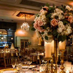 wedding venue in Philadelphia. a photo of the center piece at a table. The flower bouquet it big with pink and white flowers