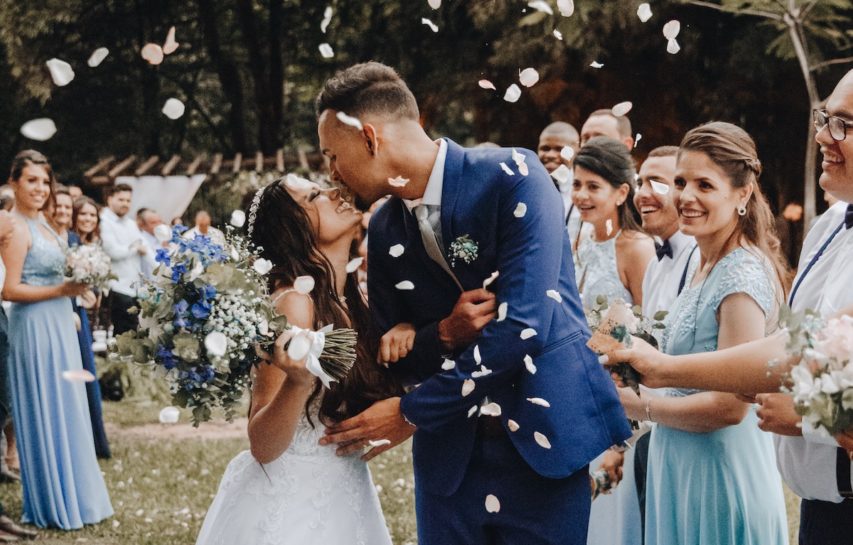 couple-celebrating-flower-petals-blue-suit-wedding-photographers-philadelphia