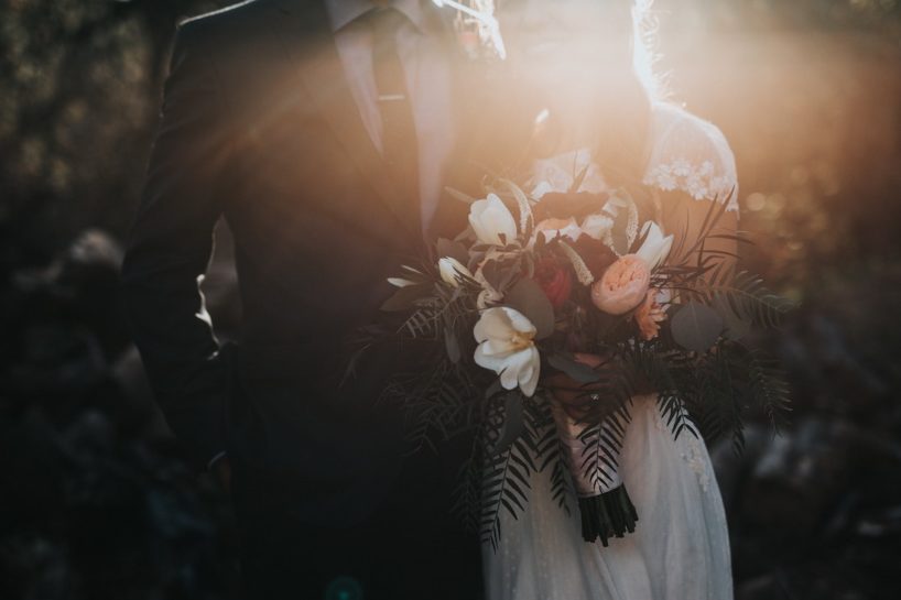 wedding couple with bouquet sunlight behind them wedding photography philadelphia