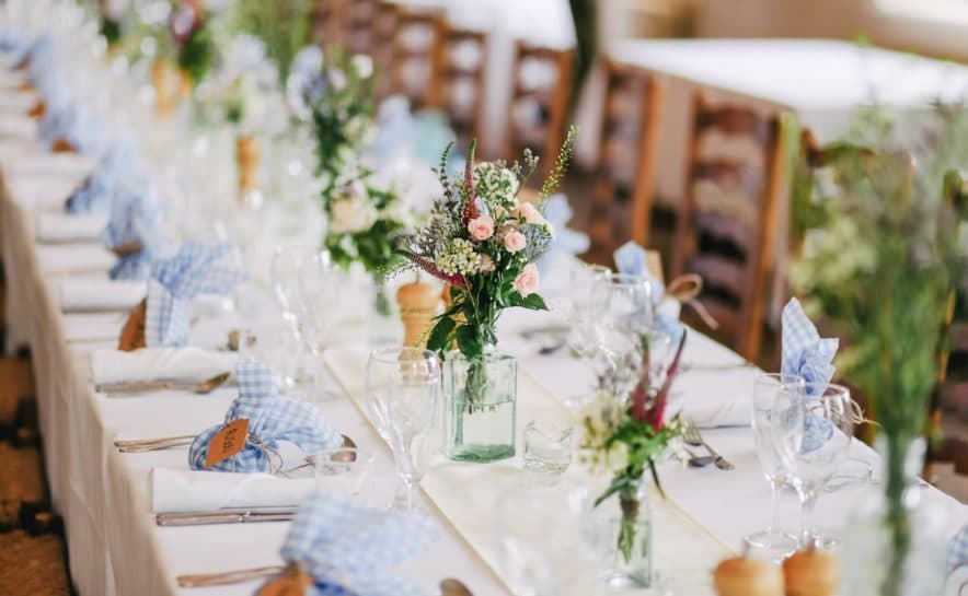 wedding-reception-table-setting-blue-napkins-flowers-wedding-videography-philadelphia